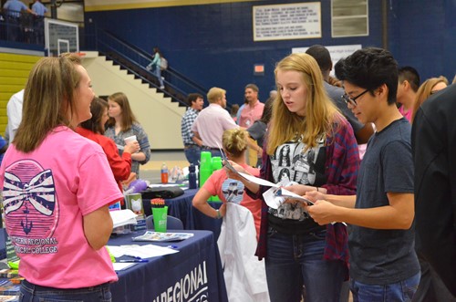 Students visit a booth at the Career Fair.