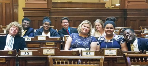 TCCHS Student Council members (diagonal left to right) Tommy Piland, JHarre Bush, Edjenee Corbin, Michael Cress, Christin Connelly, Auburne Mobley,  Sierra Hadley and Caleb Moore on the Georgia House of Representatives floor.
