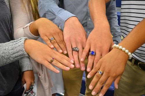 Juniors display their class rings.