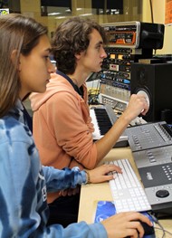 TCCHS Broadcasting students Nicholas Cooper and Natalie Wyatt listen to a track in progress for “A Yellow Jacket Christmas” CD, now in production. 