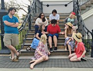  “Godspell” cast members Daniel Winchester, Cheyenne Owens, Lillie Horton, Brittney Duncan, Logan Leik, Marion Rose Young, Kendra Anderson, and Brooke Hagan gather around Stephen Sykes as “Jesus” (red shirt, center) to learn about the Beatitudes.