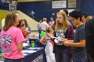 Students visit a booth at the Career Fair.