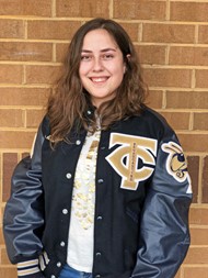 TCCHS exchange student Alina Akimbekova wears her special letterman jacket.