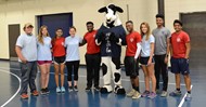  TCCHS Chick-fil-A Leader Academy members with the CFA Cow during the dodgeball event