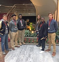 TCCHS student leaders (left to right) Jonathan Mills, Carlie Dismuke, Robert Scott, Kennedy Ward, Cameron Hadley and Zach Goff stop in the atrium of Chick-fil-A corporate headquarters. 