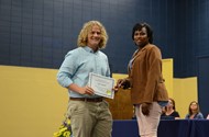 TCCHS  ?sophomore Ian Small receives the Woodmen of the World Proficiency in U.S. History award from Shannon Wynn.