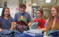  TCCHS Environmental Ambassadors (left to right) C’lee Kornegay, James Gay, Alysa Yates and Hailey Ferrel sort donations for their “Blue Jeans Go Green” drive.