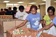 TCCHS students help pack bags for Backpack Buddies.