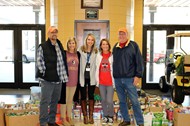 Thomas County Food Bank volunteers Wayne Adams and Maurice Chastain with TCCHS holiday canned food drive cosponsors Leigh Barwick, Kensey D’Souza and Laura Parkerson.