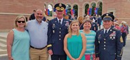 Brooklyn Reese, her family, teacher, and Georgia National Guard members share a photo opportunity during the WWI Centennial Commemoration ceremony.