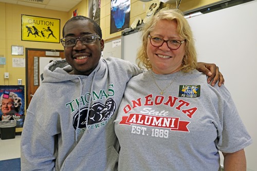 Senior Jalen Collier and teacher Amy Ponder pose in their college attire during TCCHS College Awareness Day.