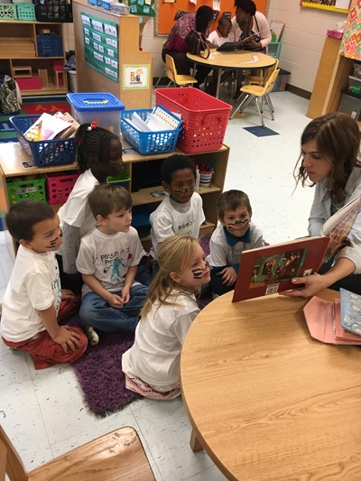 March Moms read to students.